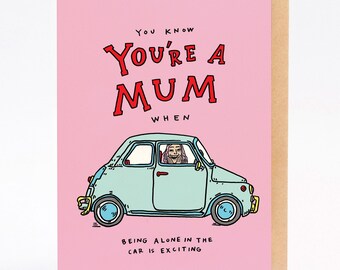 May include: A pink greeting card with the text "You know you're a mum when" in red letters. Below is a light blue car with a person inside. The text "Being alone in the car is exciting" is at the bottom.