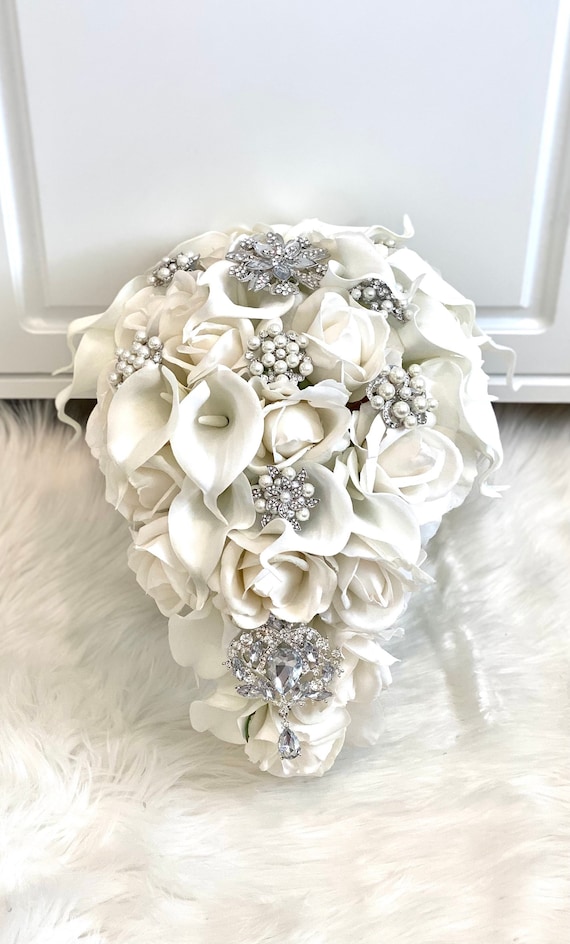 White rose bridal bouquet with crystal pins