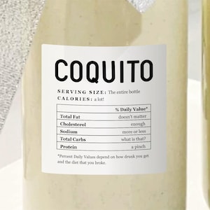 May include: A white bottle with a label that reads "COQUITO" and lists the serving size as "The entire bottle" and the calories as "a lot!" The label also includes a nutritional facts table with humorous descriptions of the % Daily Value for each nutrient.
