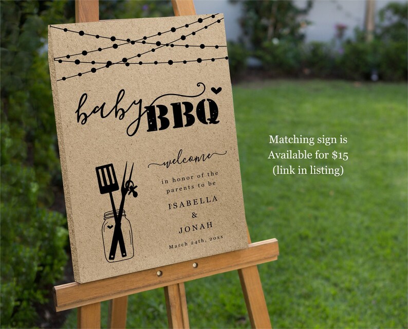 May include: A brown welcome sign with string lights, the text "baby BBQ", and the words "welcome, in honor of the parents to be, ISABELLA & JONAH, March 24th, 20xx".