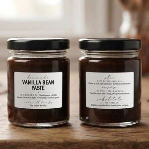 May include: Two glass jars filled with dark brown vanilla bean paste, each topped with a black lid. The front label reads "Homemade VANILLA BEAN PASTE" with ingredients listed below. The back label provides usage instructions and substitution tips.