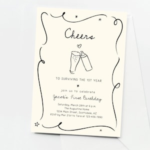 May include: Cream-coloured invitation card with black illustrations and text. The card says "Cheers" above two beer glasses and "To surviving the 1st year." It invites guests to Jacob's First Birthday, with date, time, location, and RSVP details.
