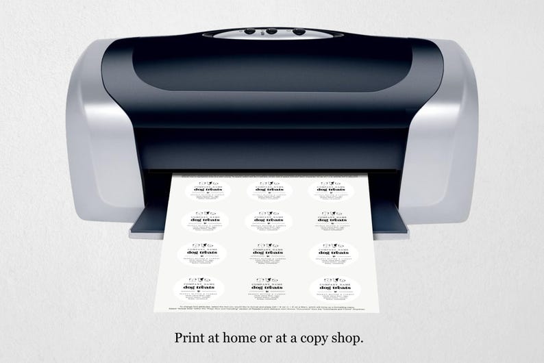 May include: A black and silver printer with a sheet of paper coming out of it. The paper has 12 round labels with the text "dog treats" printed on them. The text "Print at home or at a copy shop." is printed below the printer.