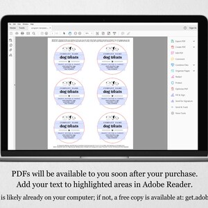 May include: A computer screen displaying a PDF document with six printable labels for dog treats. The labels are white with a light blue and pink design and the text "dog treats" in black. The text "COMPANY NAME" is also included on the labels.