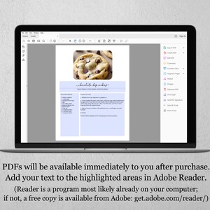 May include: A laptop screen displaying a printable recipe for chocolate chip cookies. The recipe is formatted with a light blue background and includes a photo of chocolate chip cookies. The text on the screen reads "chocolate chip cookys".