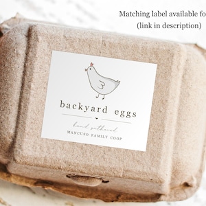 May include: A brown cardboard egg carton with a white label that says "backyard eggs" with a hand-drawn illustration of a chicken. The label also says "hand gathered" and "MANCUSO FAMILY COOP".