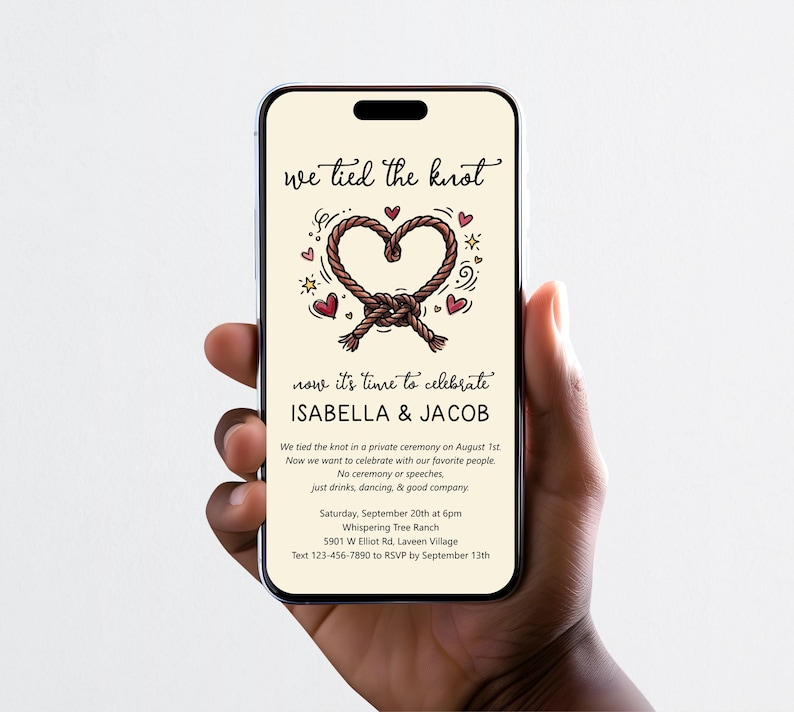 May include: A smartphone displaying a wedding invitation with the text we tied the knot, Isabella & Jacob, and event details. The design features a brown rope tied into a heart shape, surrounded by small red hearts and yellow stars on a cream background.