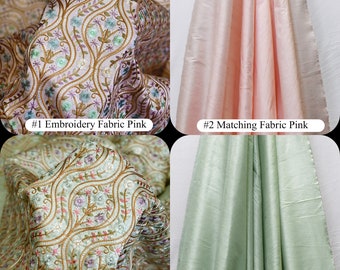 May include: Two sets of fabric swatches. The first set is pink, one with a floral embroidery pattern and the other a solid color. The second set is green, one with a floral embroidery pattern and the other a solid color. The text "GEMB85" is in the top left corner of the image. The text "Pistachio" is in the bottom right corner of the image. The text "Harshite Crafts Pvt Ltd Since 2006" is in the bottom right corner of the image.