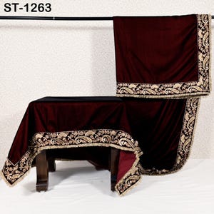 May include: A burgundy velvet table cover and matching draped fabric with ornate gold embroidery and fringe trim. The table cover is draped over a dark wooden table. The text "ST-1263" is in the top left corner.
