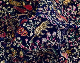 May include: Navy blue velvet fabric with intricate embroidery. The design features a gold leopard, birds, and floral patterns in shades of red, pink, green, and gold. The text "EMB-963" is visible in the upper left corner.