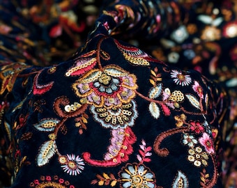 May include: Black velvet fabric with embroidered floral patterns in shades of pink, red, gold, and white. The fabric is embellished with sequins.