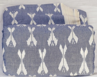 May include: Blue and white fabric with a geometric pattern. The fabric is folded in half and the pattern is visible on both sides.