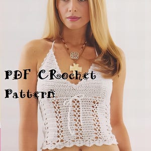 May include: White crochet halter top with a tie at the front. The top has a delicate openwork pattern and a scalloped hem. The text "PDF Crochet Pattern" is written in black on a white background.