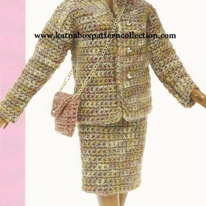May include: A doll wearing a brown and beige tweed-like outfit with a matching purse and black ankle boots. The doll has brown skin, black curly hair, and brown eyes. The doll is holding a gold chain purse. The text "www.katnaboxpatterncollection.com" is printed on the image.