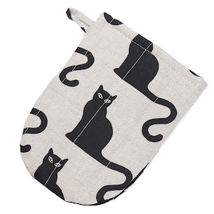 May include: A black and white oven mitt with a cat design. The mitt is made of a light gray fabric with black cats printed on it. The cats are in a sitting position with their tails curled around their bodies.