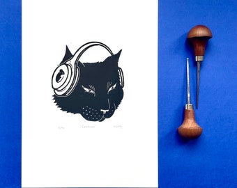 Purrfect Harmony: Linocut Print of a Music-Loving Black Cat with Headphones and Mouse Logo