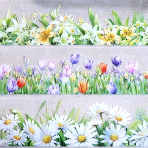 May include: Three decorative floral borders featuring white lilies, yellow and white flowers, and daisies. The middle border showcases tulips in various colors, including purple, pink, and orange, set against green grass.