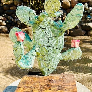 Ceramic Steel Prickly Pear Cactus Sculpture on a Manzanita Base. Sculpture currently on Exhibit. Also special made to Order by Tanya Baker