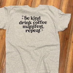 Be Kind Drink Coffee Manifest Repeat Unisex T-Shirt