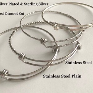 May include: Four silver bangle bracelets with different styles: silver plated and sterling silver, stainless steel diamond cut, stainless steel braided, and stainless steel plain.