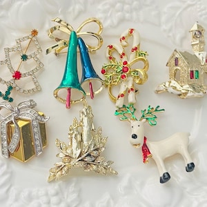 one Cute Vintage Christmas brooch-Metal brooches-reindeer- tree-candy canes-church-bells-box-candles-unsigned brooches