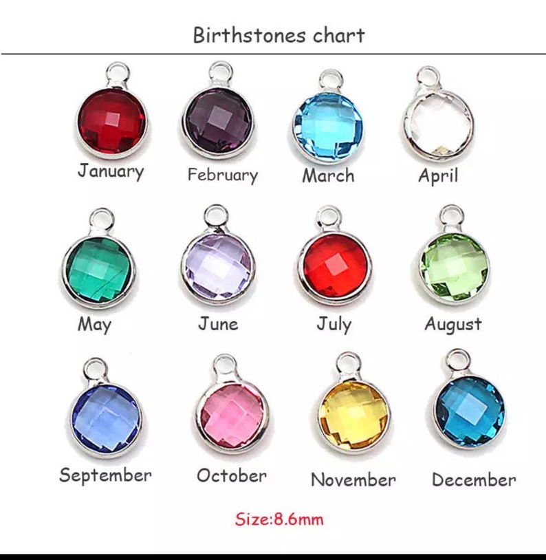 May include: Birthstone chart showing 12 different colored gemstones, each representing a month of the year. The gemstones are set in silver-toned metal charms, each measuring 8.6 mm in diameter.