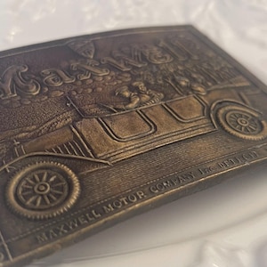 Maxwell Motor Company vintage belt buckle.made in the USA by Indiana Metal Craft-measures 3 3/4” x 2 1/2”-pre owned item