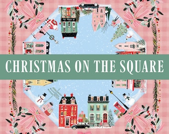 May include: A square textile print featuring a pink gingham border with four decorative wreaths and bows. The center displays a circular winter village scene with houses, snowmen, and cars, overlaid with the text CHRISTMAS ON THE SQUARE.