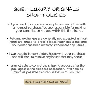 May include: A white ceramic mug with a black handle and the text "But First, Coffee" in a bold, black font. The mug is set against a blurred background, suggesting a cozy setting.