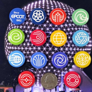May include: A collection of 14 round pins featuring various logos and designs from Epcot, a theme park at Walt Disney World. The pins are arranged in a circle on a purple background with a silver glitter effect. The pins feature a variety of colors, including red, blue, green, yellow, and white.
