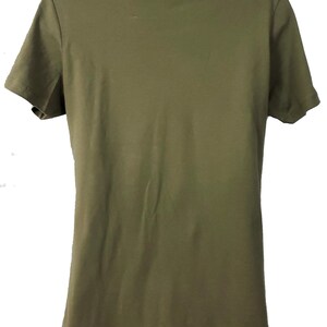 May include: A plain, olive green t-shirt with short sleeves.