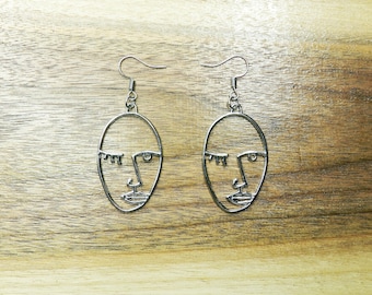 Abstract Face Dangle Earrings: Silver Art Deco Style