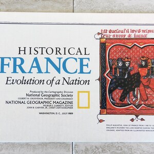 May include: A vintage map of France titled "Historical France: Evolution of a Nation." The map was produced by the Cartographic Division of the National Geographic Society in July 1989. The map features a red and gold illustration of Philip Augustus, King of France, and Richard the Lion-Hearted, King of England, on horseback. The text "tat dueloufit lavis nelpulat la Ceuranmy de bunce" is written in a banner above the illustration.