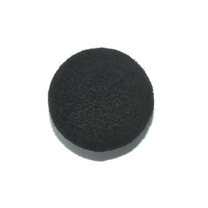 May include: A black, round, textured ball.