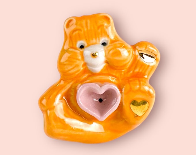 Orange Care Bear Pipe Paw Raised