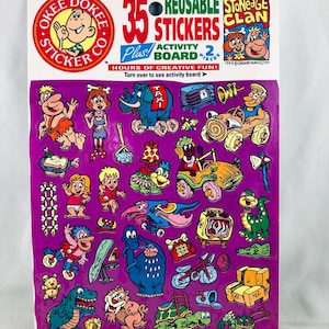 May include: A set of three ceramic mugs with a speckled, matte finish. The mugs are in shades of cream, light grey, and dark grey. Each mug has a simple, minimalist design, ideal for coffee or tea.