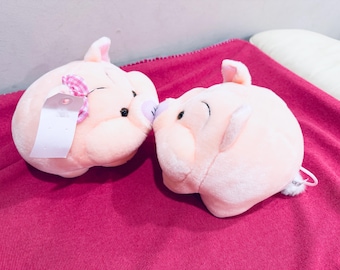 2 kissing pig plush. pull string feature. NEW