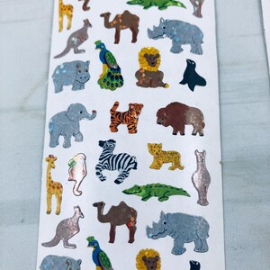 Sandylion animal kingdom - 2 strisce adesive. Errore di produzione in fabbrica. Leone Zebra Elefante Cammello Scimmia. Nessuna etichetta sul retro. NUOVO