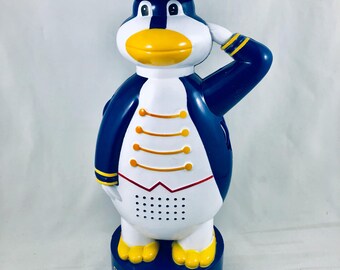 Star Cruise ship penguin mascot AM radio and calculator