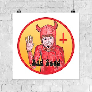 May include: A red devil character with horns and a goatee wearing a red suit with a black bow tie. The character is waving with one hand and the other hand is holding a black cross. The character is in a yellow circle with a red outline. The text "Bad Seed" is written in black below the character.