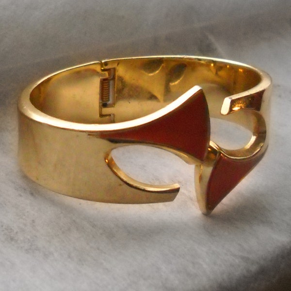 60s Orena bracelet; Art Deco. Gold plated brass and orange plastic film, abstract design,, made in france
