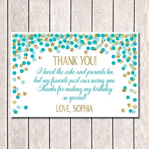 May include: A white thank you card with gold and teal confetti. The card has the words "THANK YOU!" in gold, a handwritten message, and "LOVE, SOPHIA".