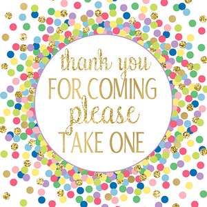 May include: A white card with a gold circle containing the text "thank you for coming please take one". The background is filled with colorful confetti.