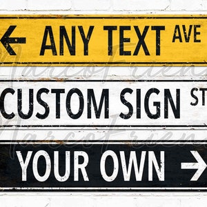 Custom road sign wall decor with bold industrial typography and faux rust texture on sandy background.