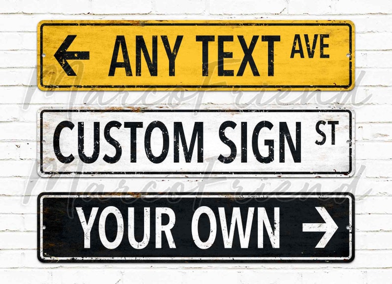 Custom road sign wall decor with bold industrial typography and faux rust texture on sandy background.