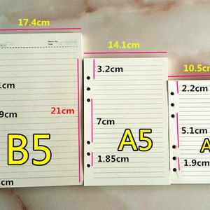 May include: Three different sizes of white lined paper notebooks with punched holes on the left side. The notebooks are labeled B5, A5, and A6. The measurements of each notebook are listed in centimeters.