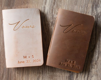 May include: Two leather-bound journals with the word "Vows" embossed on the front. The journals are personalized with the initials "M+S" and the date "June 22, 2024".