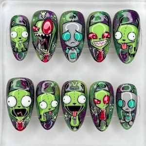 May include: A set of ten press-on nails featuring hand-painted illustrations of characters from Invader Zim. Each nail has a glossy finish with a galaxy-themed background in shades of purple and green, showcasing various expressions of Gir and Zim.