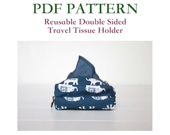 Pode incluir: Um porta-lenços de tecido azul com estampa de elefante branco e fecho de correr. O porta-lenços é de dupla face e reutilizável.  PDF PATTERN: Reusable Double Sided Travel Tissue Holder