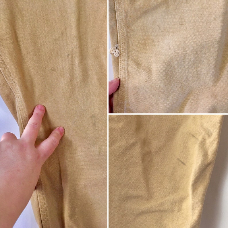 May include: Close-up of tan-colored work pants, showing details of the fabric and stitching. The image highlights the texture and color variations of the pants, with some visible wear and tear.